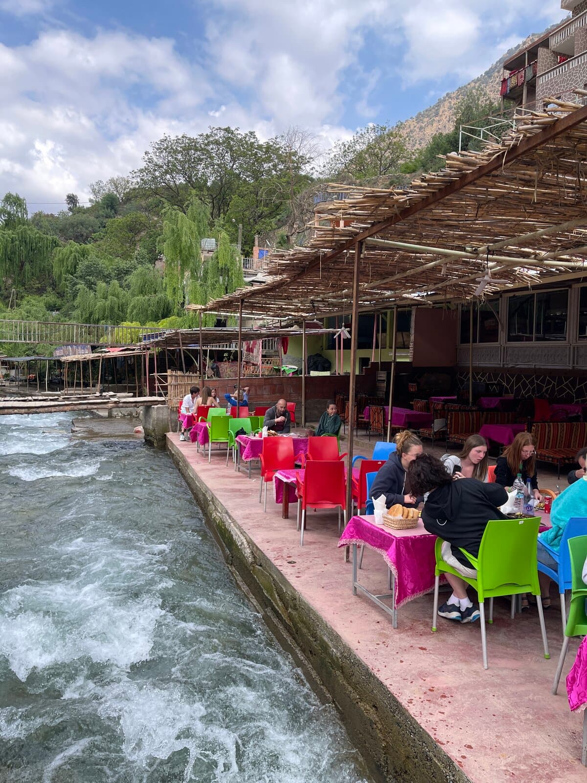 Colorful chairs by the river